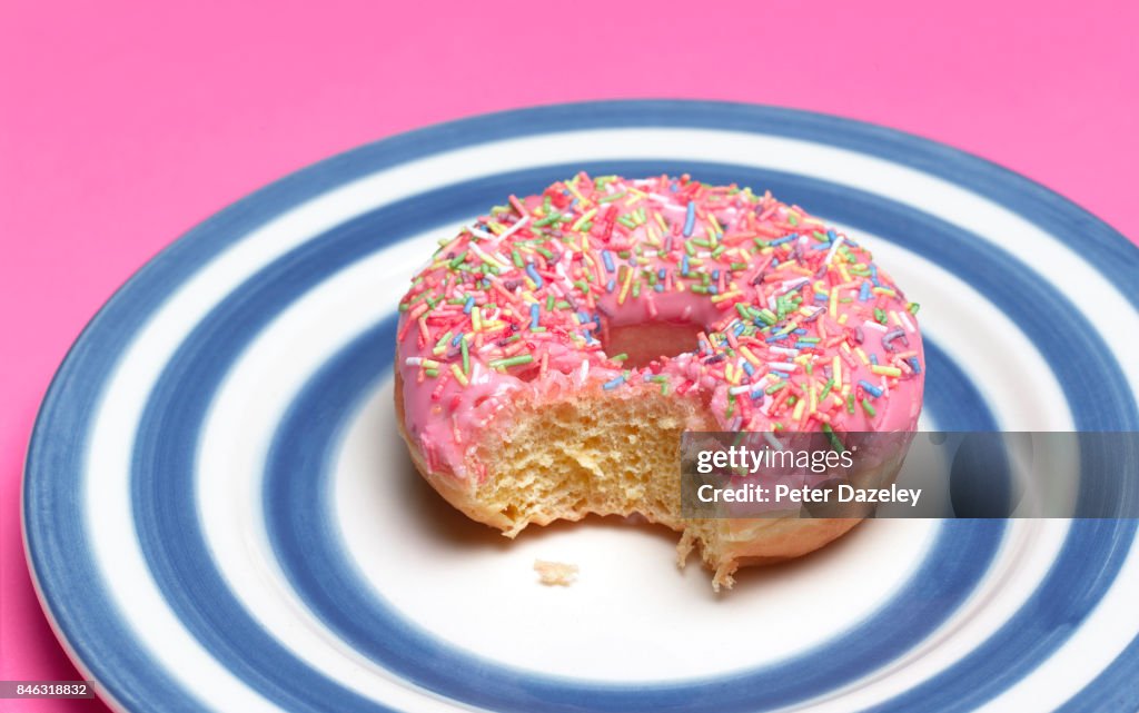 PINK DOUGHNUT ON PLATE