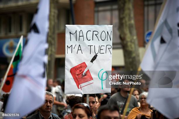Placrd reading 'Macron kill me' with a Work Code stabbed. More than 10000 protesters took to the streets of Toulouse against the new Macron's reforms...
