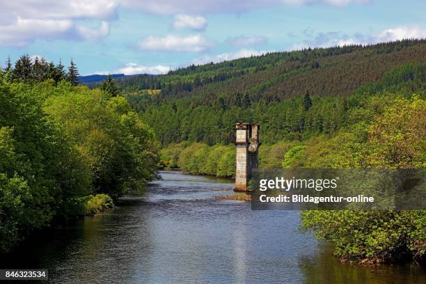 Scotland. Highlands. Historical Bridge Pier Stands In The River Oich At The Place Fort Augustus At The Southern End of The Loch Ness..
