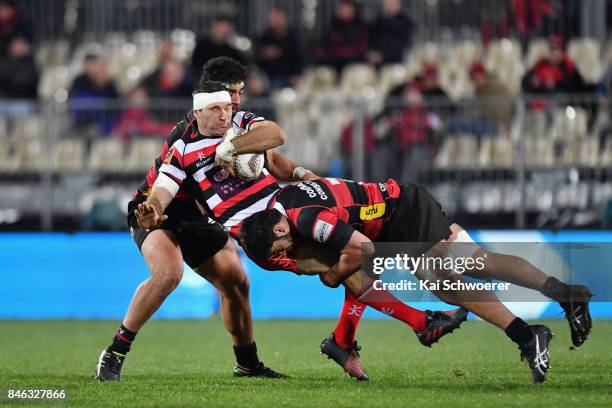 Stephen Donald of Counties Manukau is tackled by Billy Harmon of Canterbury during the round five Mitre 10 Cup match between Canterbury and Counties...