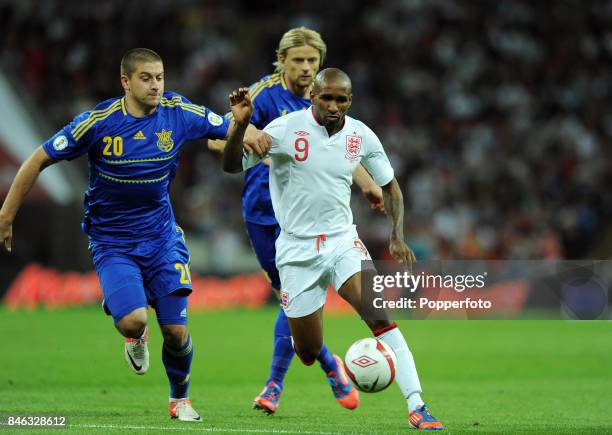 Jermain Defoe of England and Yaroslav Rakitskiy of Ukraine in action during the FIFA 2014 World Cup qualifying match between England and Ukraine at...