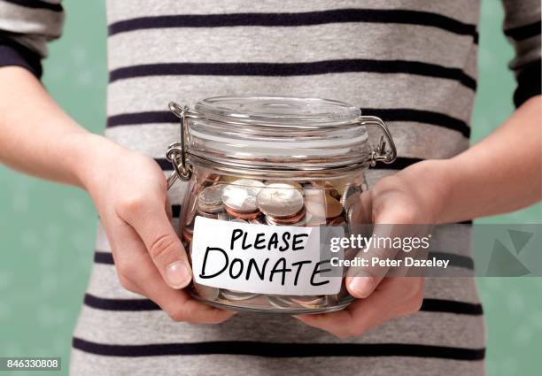 please donate charity jar - money donation stock-fotos und bilder