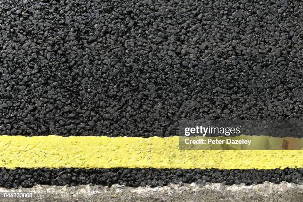 yellow line road marking - yellow line stockfoto's en -beelden