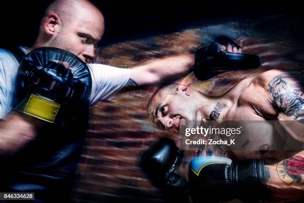 young man at boxing training - dodging stock pictures, royalty-free photos & images