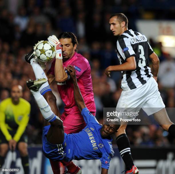 Ramires of Chelsea with Giorgio Chiellini and Gianluigi Buffon both of Juventus in action during the UEFA Champions League match between Chelsea and...