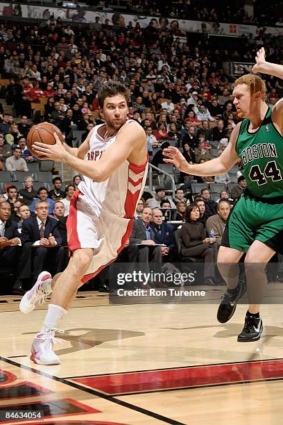Andrea Bargnani of the Toronto Raptors drives against Brian Scalabrine of the Boston Celtics during the game on January 11, 2009 at Air Canada Centre...