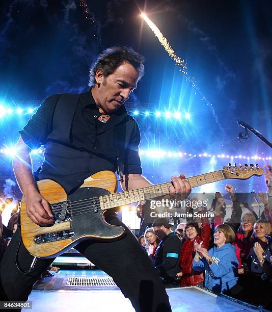 Musician Bruce Springsteen and the E Street Band perform at the Bridgestone halftime show during Super Bowl XLIII between the Arizona Cardinals and...