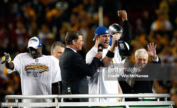 Santonio Holmes, Ben Roethlisberger and team owner Dan Rooney of the Pittsburgh Steelers celebrate with the Vince Lonbardi trophy after the defeated...