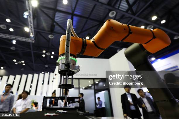Hanwha Techwin Co. Robotic arm operates during a demonstration at the RobotWorld 2017 industry show in Goyang, South Korea, on Wednesday, Sept. 13,...