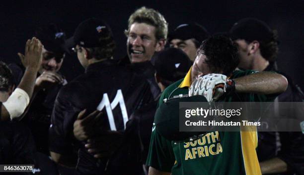 New Zealand bowler Jacob Oram celebrates the wicket of South Africa captain Graeme Smith during their ICC Champions Trophy match at CCI on Monday.