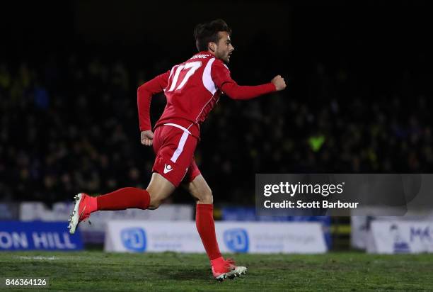 Nikola Mileusnic of Adelaide United is congratulated by his teammates after scoring his second goal during the FFA Cup Quarter Final match between...