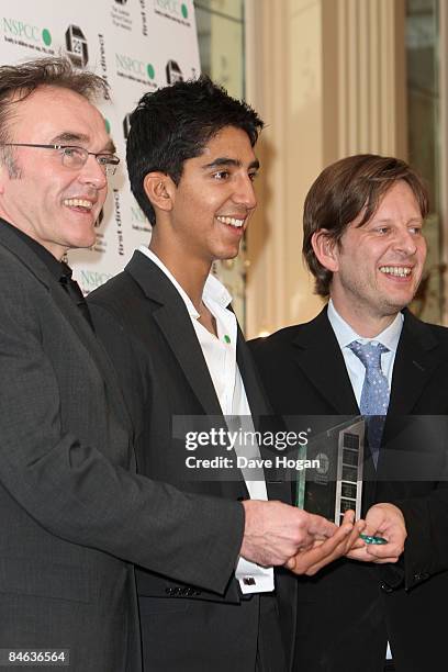 Danny Boyle, Dev Patel and Christian Colson pose in the winners room at the London Critics' Circle Film Awards held at the Grosvenor House Hotel,...