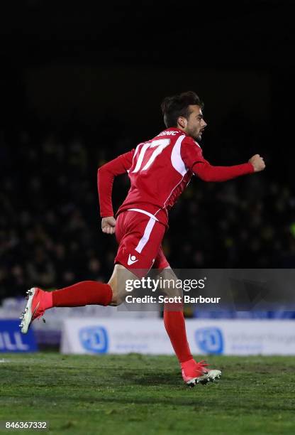 Nikola Mileusnic of Adelaide United is congratulated by his teammates after scoring his second goal during the FFA Cup Quarter Final match between...