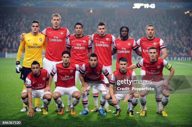 The Arsenal team pose for a group picture prior to the UEFA Champions League match between Arsenal and FC Schalke at the Emirates Stadium on October...