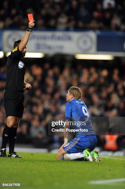 Fernando Torres of Chelsea is given a red card by referee Mark Clattenburg during the Barclays Premier League match between Chelsea and Manchester...