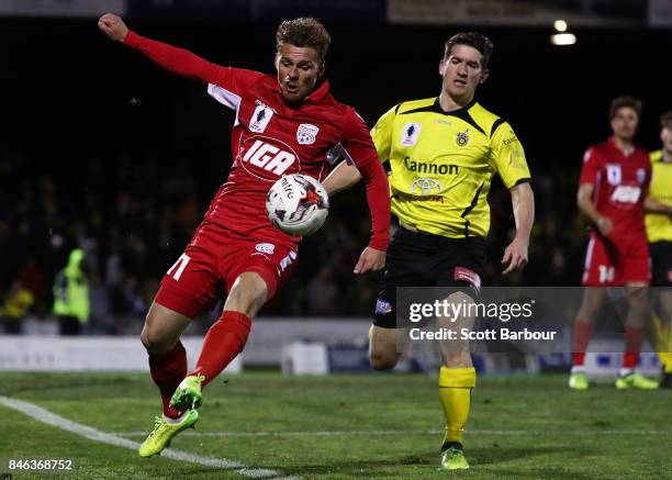 Johan Absalonsen of Adelaide United competes for the ball during the FFA Cup Quarter Final match between Heidelberg United FC and Adelaide United at...