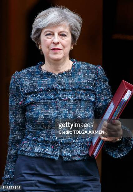 Britain's Prime Minister Theresa May leaves 10 Downing Street in central London on September 13 on her way to the Houses of Parliament to speak at...