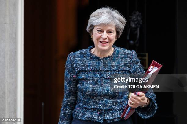 Britain's Prime Minister Theresa May leaves 10 Downing Street in central London on September 13 on her way to the Houses of Parliament to speak at...