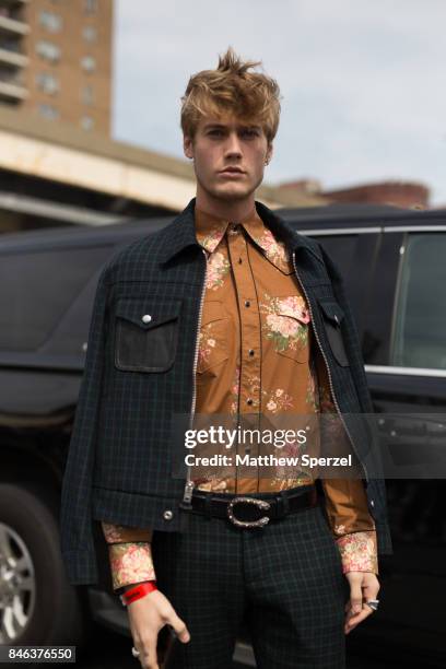 Neels Visser is seen attending Coach during New York Fashion Week wearing a green suit with brown shirt on September 12, 2017 in New York City.