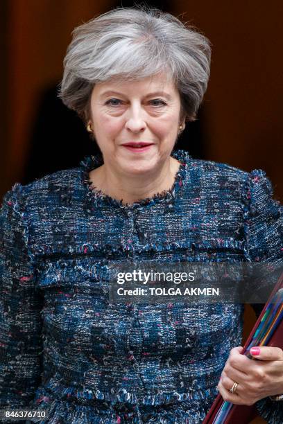 Britain's Prime Minister Theresa May leaves 10 Downing Street in central London on September 13 on her way to the Houses of Parliament to speak at...