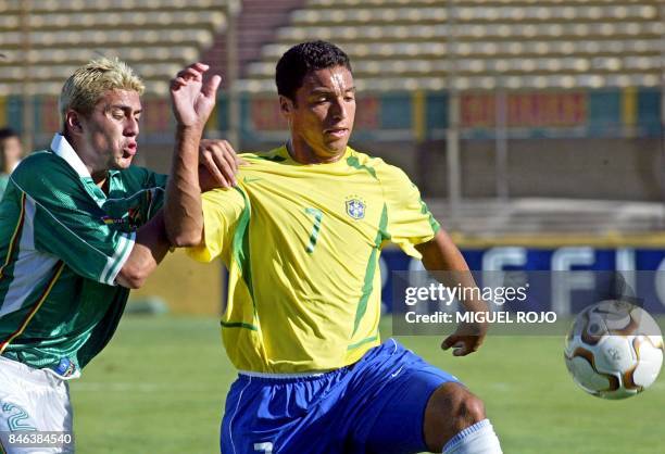 Daniel Carvalho , of the Brazilian team, battles for the ball against Bolivian Sergio Jauregui, 07 January 2003 at the Cenetario Stadium in...