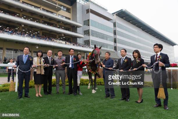 Jockey Kim Yong Geun and other connections celebrate after winning the JRA Trophy at Seoul Racecourse on September 9, 2017 in Seoul, South Korea. The...