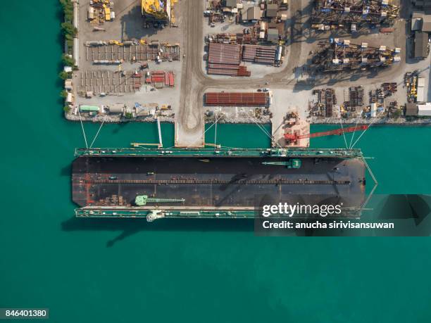 aerial view shipyard have crane machine and container ship in green sea . - shipbuilder stock pictures, royalty-free photos & images