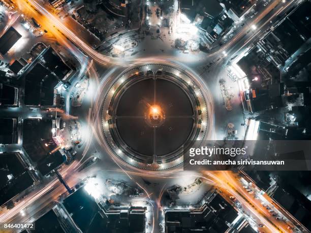 aerial view traffic circle and in city light speed at night , thailand . - weltmarkt stock-fotos und bilder