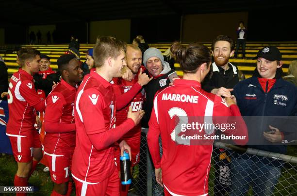 Adelaide United players thank their supporters in the crowd after winning the FFA Cup Quarter Final match between Heidelberg United FC and Adelaide...