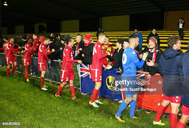 Adelaide United players thank their supporters in the crowd after winning the FFA Cup Quarter Final match between Heidelberg United FC and Adelaide...