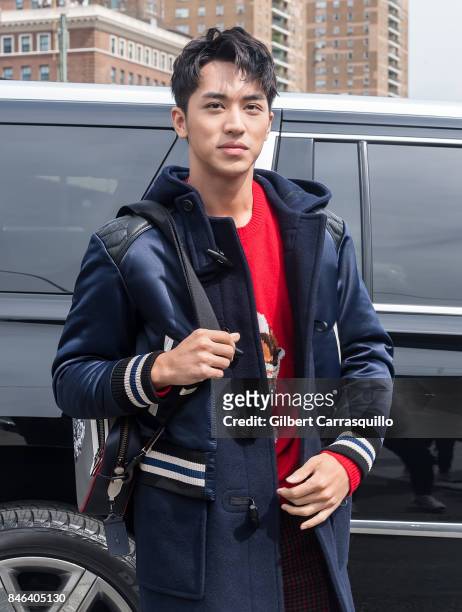Actor Xu Weizhou is seen arriving to Coach Spring 2018 fashion show during New York Fashion Week at Basketball City - Pier 36 - South Street on...
