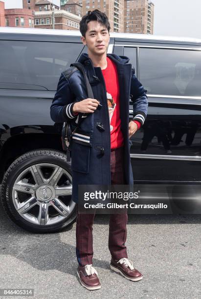 Actor Xu Weizhou is seen arriving to Coach Spring 2018 fashion show during New York Fashion Week at Basketball City - Pier 36 - South Street on...