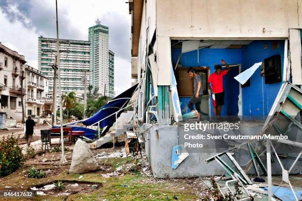 Cubans clean their houses after the flooding, three days after Hurricane Irma passed over Cuba, on September 12 in Havana, Cuba. Hundreds of...