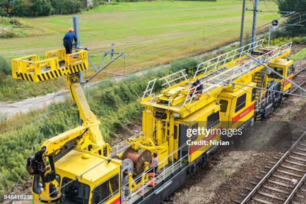 workers repair railway electric traction - train gantry stock pictures, royalty-free photos & images