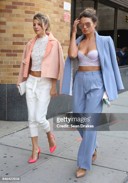 Olga Slesarenco wearing a Zara ensemble with Christian Louboutin shoes and Natalia Levsina wearing a Zara suit pose in the Spring/Summer 2018...