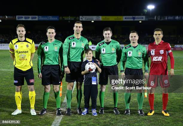 Luke Byles of Heidelberg United FC and Isaas of Adelaide United pose during the NAB Coin Toss during the FFA Cup Quarter Final match between...
