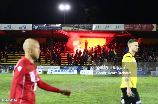 Flare is let off in the crowd during the FFA Cup Quarter Final match between Heidelberg United FC and Adelaide United at Olympic Village on September...
