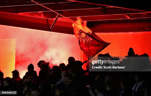 Flare is let off in the crowd during the FFA Cup Quarter Final match between Heidelberg United FC and Adelaide United at Olympic Village on September...