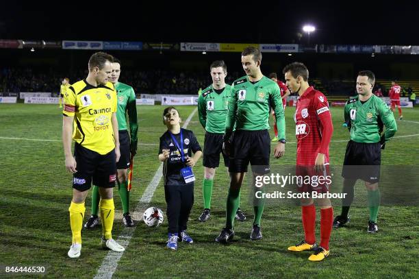 Luke Byles of Heidelberg United FC and Isaas of Adelaide United pose during the NAB Coin Toss during the FFA Cup Quarter Final match between...