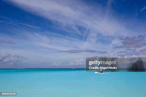 sailing a catamaran in the azure waters of the caribbean - catamaran sailing stock pictures, royalty-free photos & images