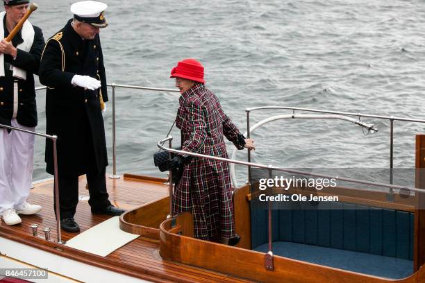 Queen Margrethe II of Denmark returns to quay after attending the farewell parade at the royal ship Dannebrog which marks the end of the sailing...