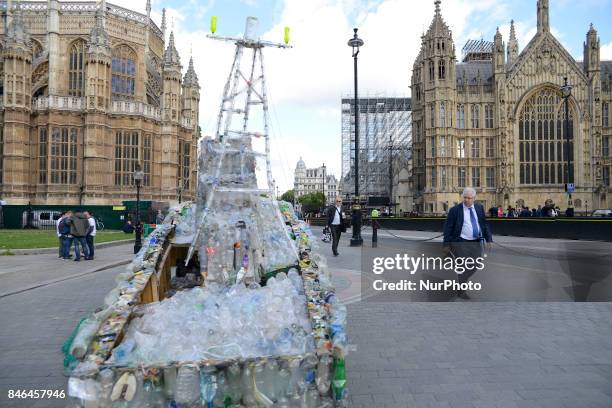 Boat made of plastic bottles, is seen outside the Parliament, in London on September 13, 2017. The boat has been built by the members of 'Surfers...