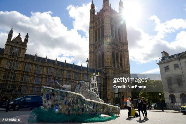 Boat made of plastic bottles, is seen outside the Parliament, in London on September 13, 2017. The boat has been built by the members of 'Surfers...