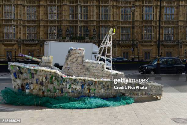 Boat made of plastic bottles, is seen outside the Parliament, in London on September 13, 2017. The boat has been built by the members of 'Surfers...