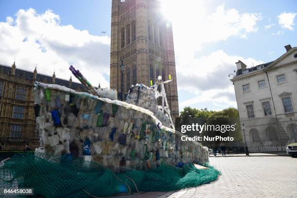 Boat made of plastic bottles, is seen outside the Parliament, in London on September 13, 2017. The boat has been built by the members of 'Surfers...