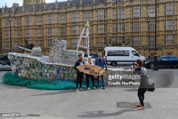 Boat made of plastic bottles, is seen outside the Parliament, in London on September 13, 2017. The boat has been built by the members of 'Surfers...
