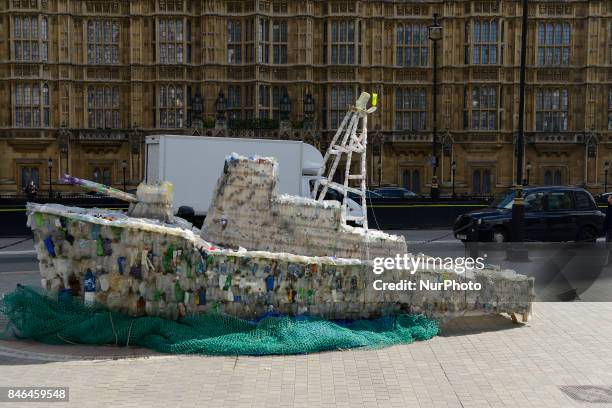 Boat made of plastic bottles, is seen outside the Parliament, in London on September 13, 2017. The boat has been built by the members of 'Surfers...