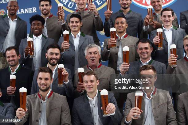 Head coach Carlo Ancelotti and players attend the FC Bayern Muenchen Paulaner photo shoot in traditional Bavarian lederhosen on September 13, 2017 in...