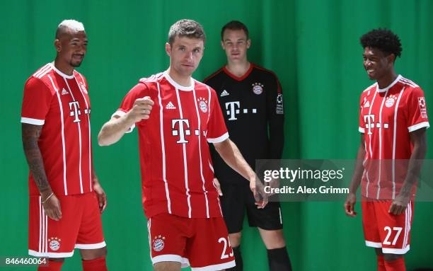 Jerome Boateng, Thomas Mueller, Manuel Neuer and David Alaba attend the FC Bayern Muenchen Paulaner photo shoot in traditional Bavarian lederhosen on...