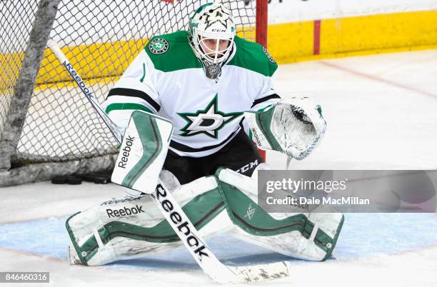 Goaltender Jhonas Enroth of the Dallas Stars warms up before the game against the Edmonton Oilers at Rexall Place on March 27, 2015 in Edmonton,...